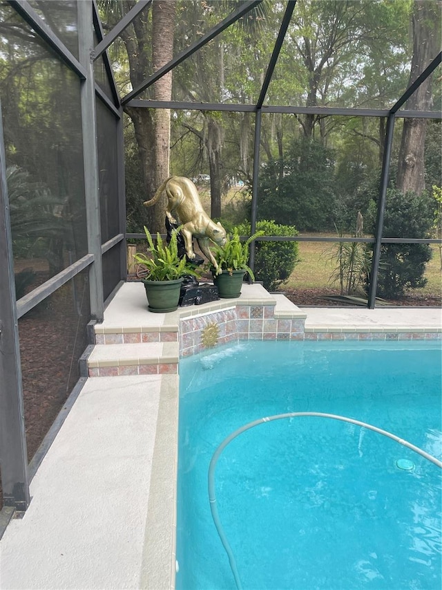outdoor pool featuring a lanai