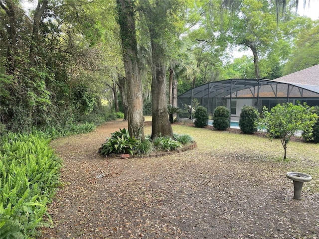 view of yard with a lanai