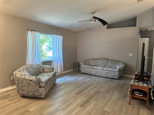 6082 SW 104th St, Ocala, FL 34476 - living area featuring ceiling fan, wood finished floors, baseboards, and lofted ceiling