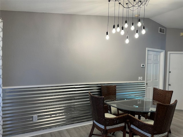 6082 SW 104th St, Ocala, FL 34476 - dining room featuring wood finished floors and lofted ceiling