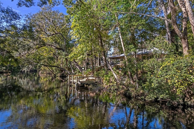 exterior space featuring a forest view