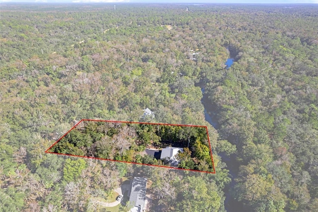 drone / aerial view with a view of trees
