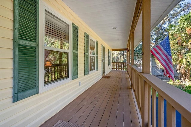 wooden terrace featuring a porch