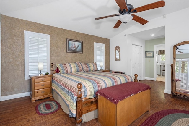 bedroom featuring a ceiling fan, a closet, baseboards, and wood finished floors