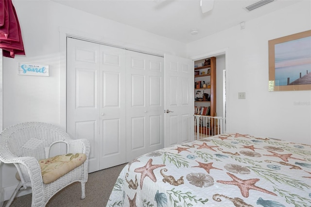 bedroom featuring visible vents, a closet, ceiling fan, and carpet