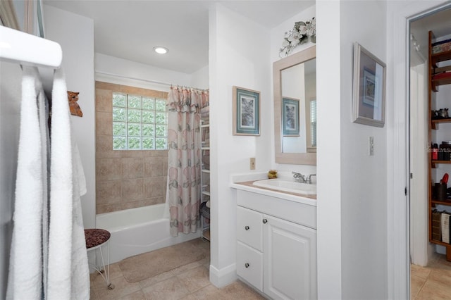 full bathroom featuring tile patterned flooring, vanity, and shower / bath combo with shower curtain
