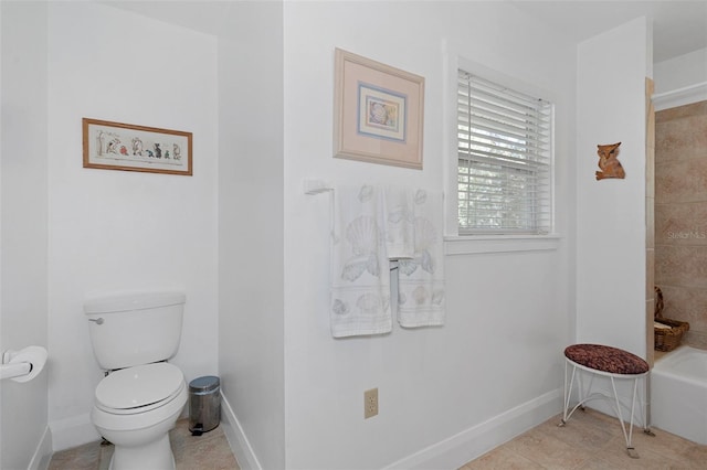 full bath with tile patterned floors, toilet, a shower, a washtub, and baseboards