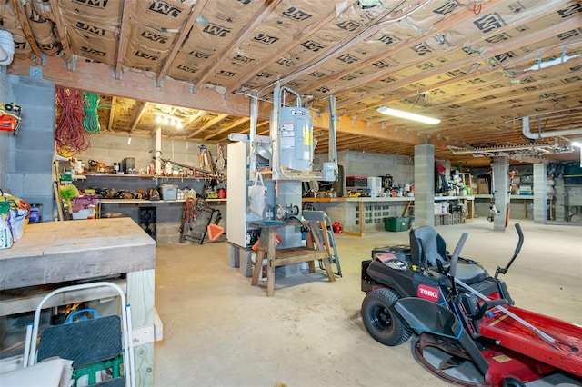 garage featuring water heater and a workshop area