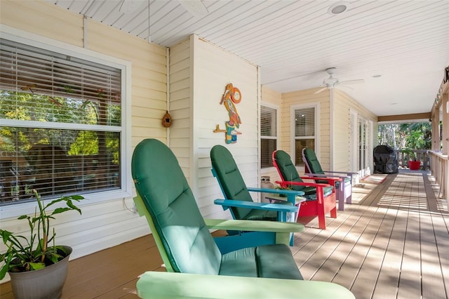 deck featuring a porch, a grill, and ceiling fan