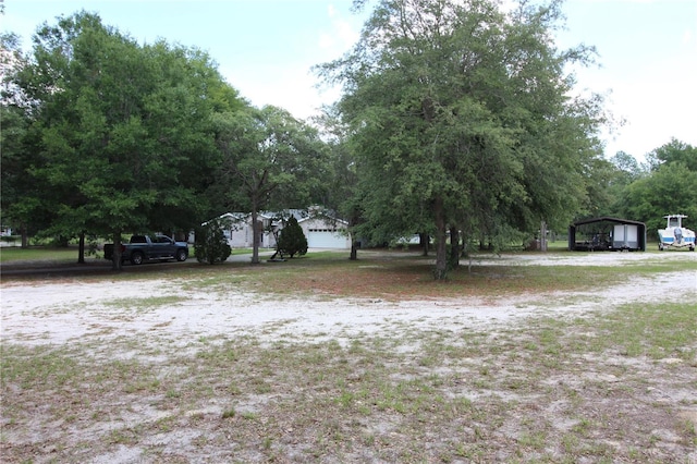 view of yard featuring a carport