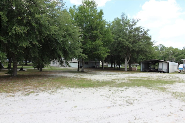 view of yard with a carport