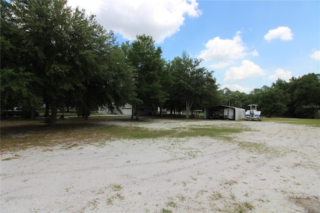 view of yard featuring a detached carport