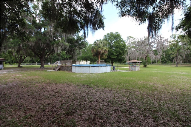 view of yard with an outdoor pool