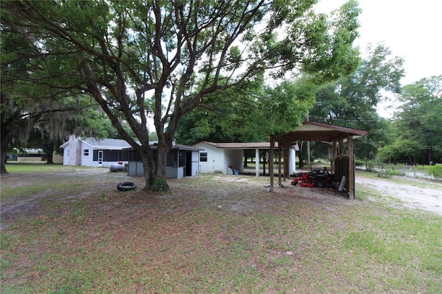 single story home featuring a carport