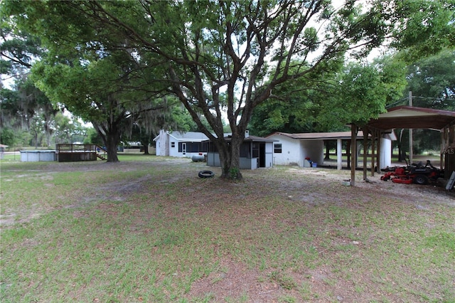 view of yard with a carport