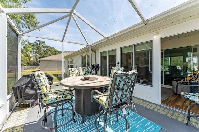 sunroom / solarium featuring outdoor dining area