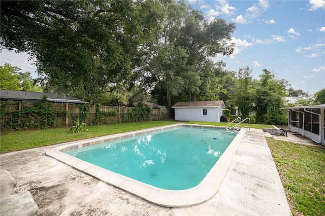 4516 NE 8th St, Ocala, FL 34470 - view of pool with a sunroom, an outbuilding, view of scattered trees, and a patio area