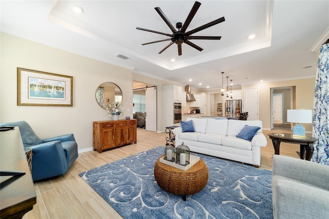 10445 SW 90th Street Rd, Ocala, FL 34481 - living room with a raised ceiling, ceiling fan, recessed lighting, ornamental molding, and light wood finished floors