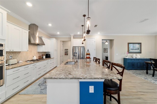 10445 SW 90th Street Rd, Ocala, FL 34481 - kitchen featuring wall chimney exhaust hood, stainless steel refrigerator with ice dispenser, a sink, a breakfast bar, and white cabinetry