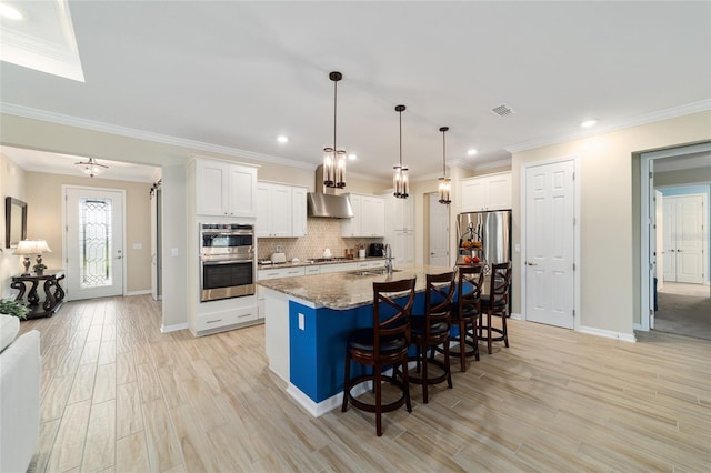 10445 SW 90th Street Rd, Ocala, FL 34481 - kitchen featuring ventilation hood, appliances with stainless steel finishes, light wood-type flooring, a kitchen bar, and decorative backsplash