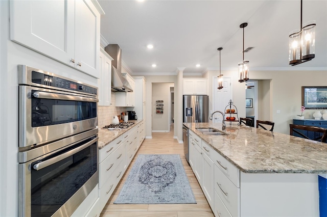 10445 SW 90th Street Rd, Ocala, FL 34481 - kitchen featuring stainless steel appliances, a sink, backsplash, a large island with sink, and white cabinetry