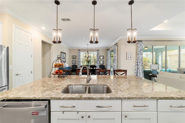 10445 SW 90th Street Rd, Ocala, FL 34481 - kitchen featuring a sink, open floor plan, ornamental molding, stainless steel appliances, and light stone counters