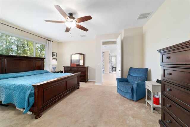 10445 SW 90th Street Rd, Ocala, FL 34481 - bedroom with light carpet, a ceiling fan, and baseboards