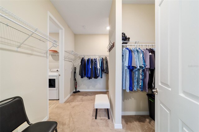 10445 SW 90th Street Rd, Ocala, FL 34481 - walk in closet featuring washer / dryer and carpet flooring