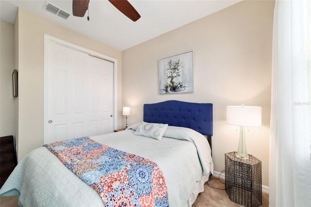 10445 SW 90th Street Rd, Ocala, FL 34481 - bedroom with a closet, carpet floors, a ceiling fan, and baseboards
