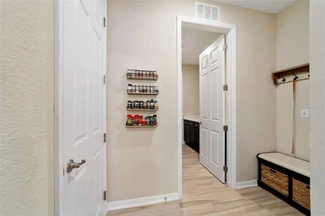 10445 SW 90th Street Rd, Ocala, FL 34481 - hallway with light wood-type flooring and baseboards