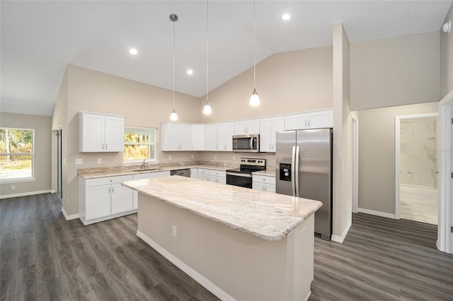 kitchen with stainless steel appliances, a center island, dark wood finished floors, a sink, and white cabinets