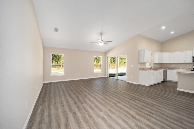 unfurnished living room featuring baseboards, lofted ceiling, ceiling fan, and wood finished floors