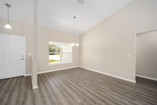 interior space featuring baseboards, visible vents, and wood finished floors
