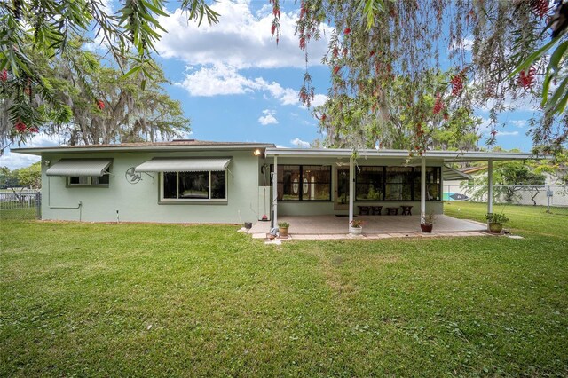 12180 Maple St, Dunnellon, FL 34432 - rear view of property with a patio area and stucco siding
