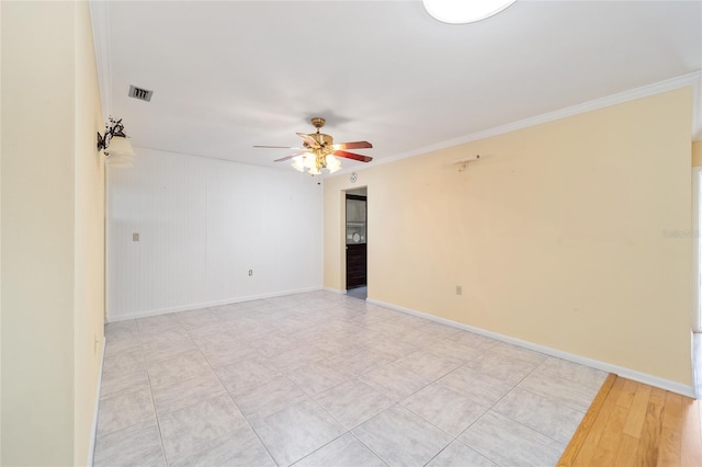 12180 Maple St, Dunnellon, FL 34432 - empty room with a ceiling fan, baseboards, and crown molding