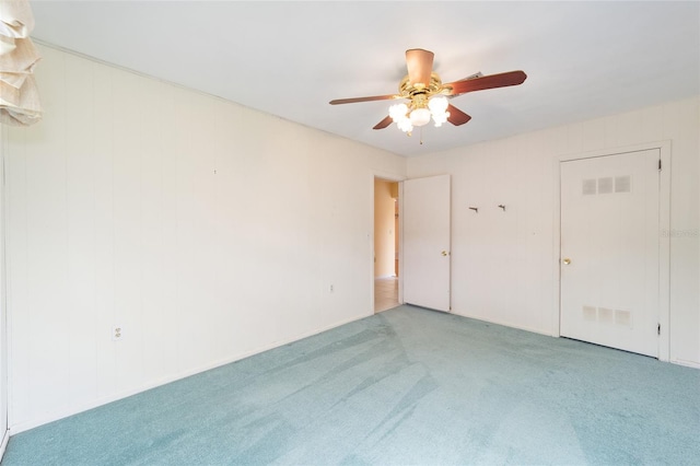 12180 Maple St, Dunnellon, FL 34432 - unfurnished bedroom featuring carpet floors and a ceiling fan