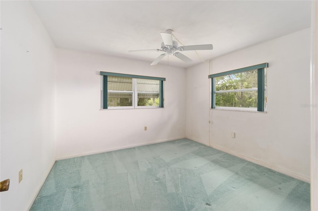 12180 Maple St, Dunnellon, FL 34432 - carpeted spare room with ceiling fan and baseboards