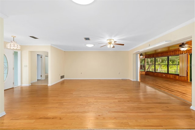 12180 Maple St, Dunnellon, FL 34432 - unfurnished living room with ceiling fan, light wood finished floors, and crown molding