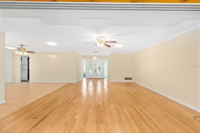 12180 Maple St, Dunnellon, FL 34432 - unfurnished living room with ceiling fan, crown molding, and light wood finished floors
