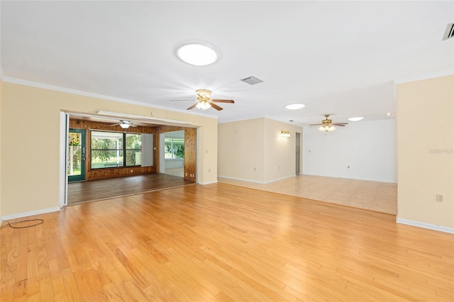 12180 Maple St, Dunnellon, FL 34432 - unfurnished living room featuring wood finished floors, ceiling fan, and crown molding