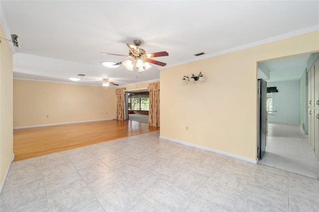 12180 Maple St, Dunnellon, FL 34432 - empty room with a ceiling fan and ornamental molding