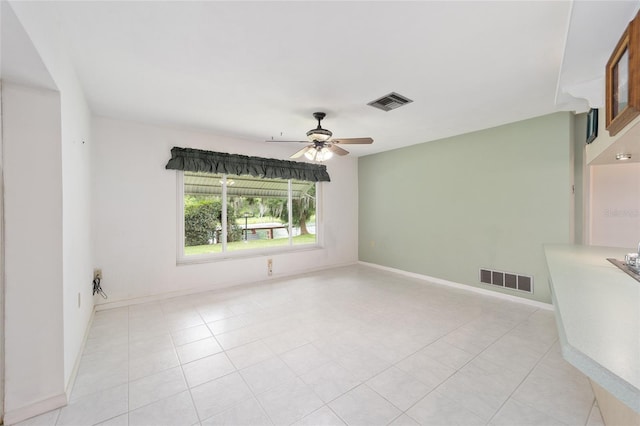 12180 Maple St, Dunnellon, FL 34432 - spare room featuring a ceiling fan and light tile patterned flooring