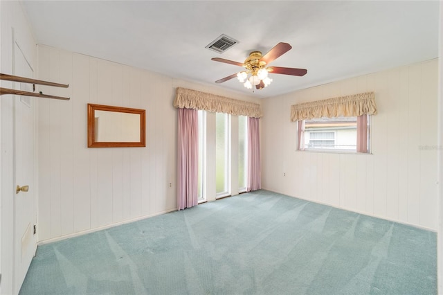 12180 Maple St, Dunnellon, FL 34432 - carpeted empty room with a ceiling fan