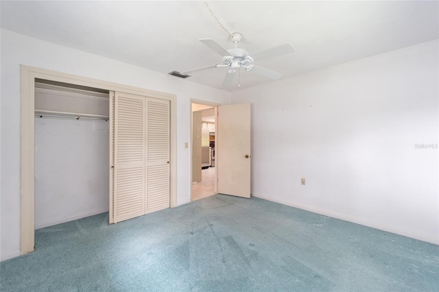 12180 Maple St, Dunnellon, FL 34432 - unfurnished bedroom with carpet floors, a closet, and a ceiling fan
