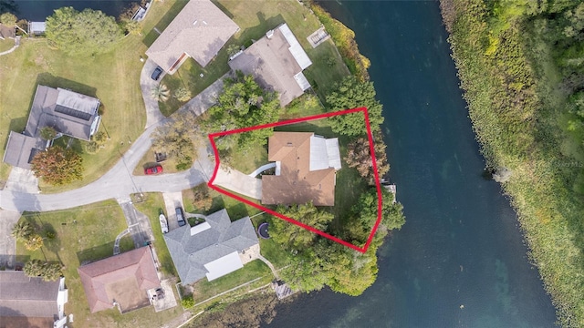 12180 Maple St, Dunnellon, FL 34432 - aerial perspective of suburban area featuring a large body of water and property boundaries highlighted