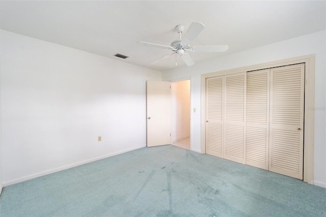 12180 Maple St, Dunnellon, FL 34432 - unfurnished bedroom with carpet, a closet, and a ceiling fan