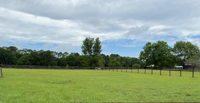 view of green lawn with a view of rural / pastoral area