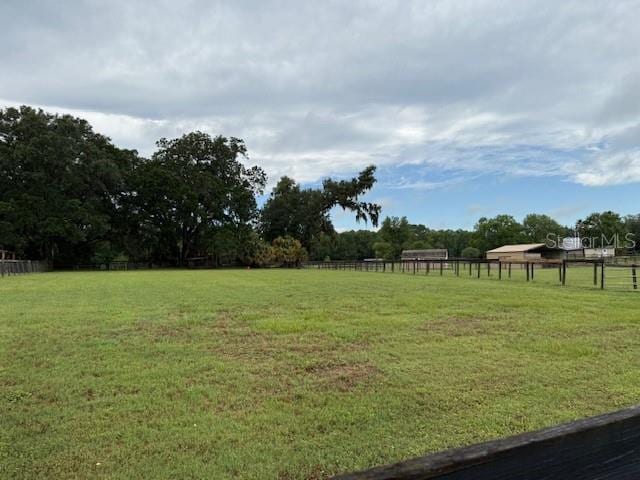 view of yard featuring a view of rural / pastoral area