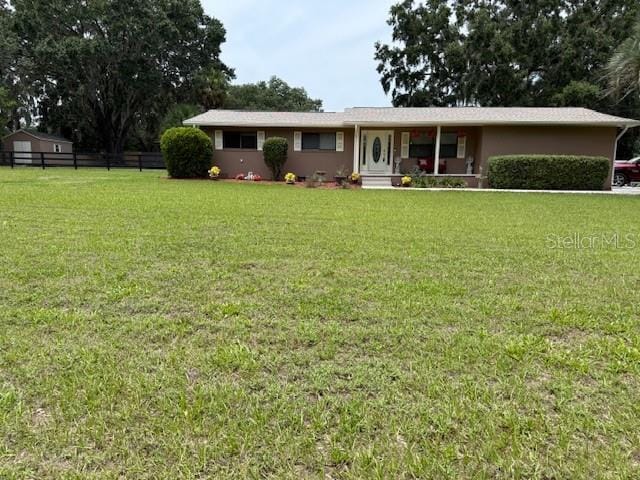 6020 NW 2nd Ave, Ocala, FL 34475 - ranch-style home featuring a porch and stucco siding