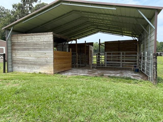 6020 NW 2nd Ave, Ocala, FL 34475 - view of parking / parking lot featuring an exterior structure and a detached carport